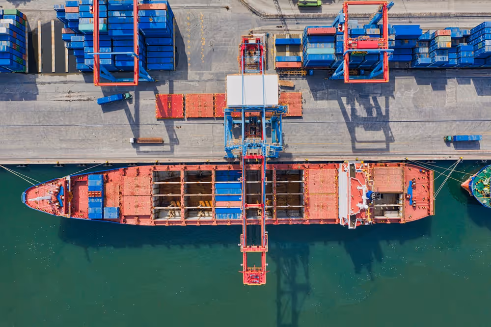 Aerial view of a loaded container ship at sea